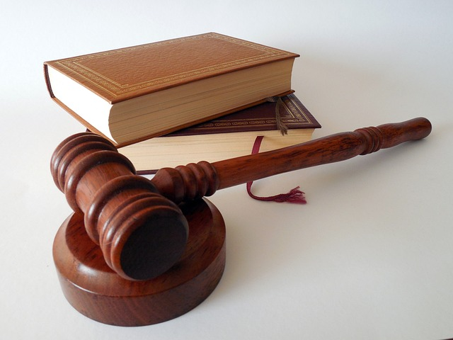 court gavel, criminal defense law books